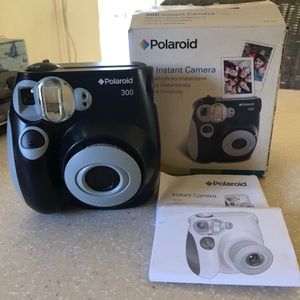 Never used. Polaroid 300 Instant Camera. In box.